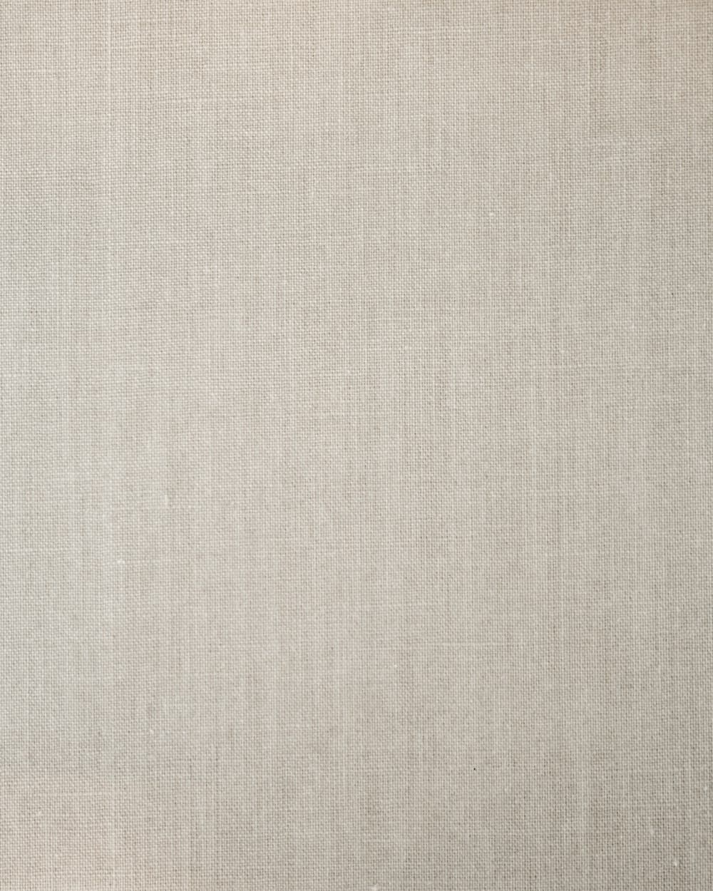 Close-up of natural linen-cotton fabric in a warm beige tone